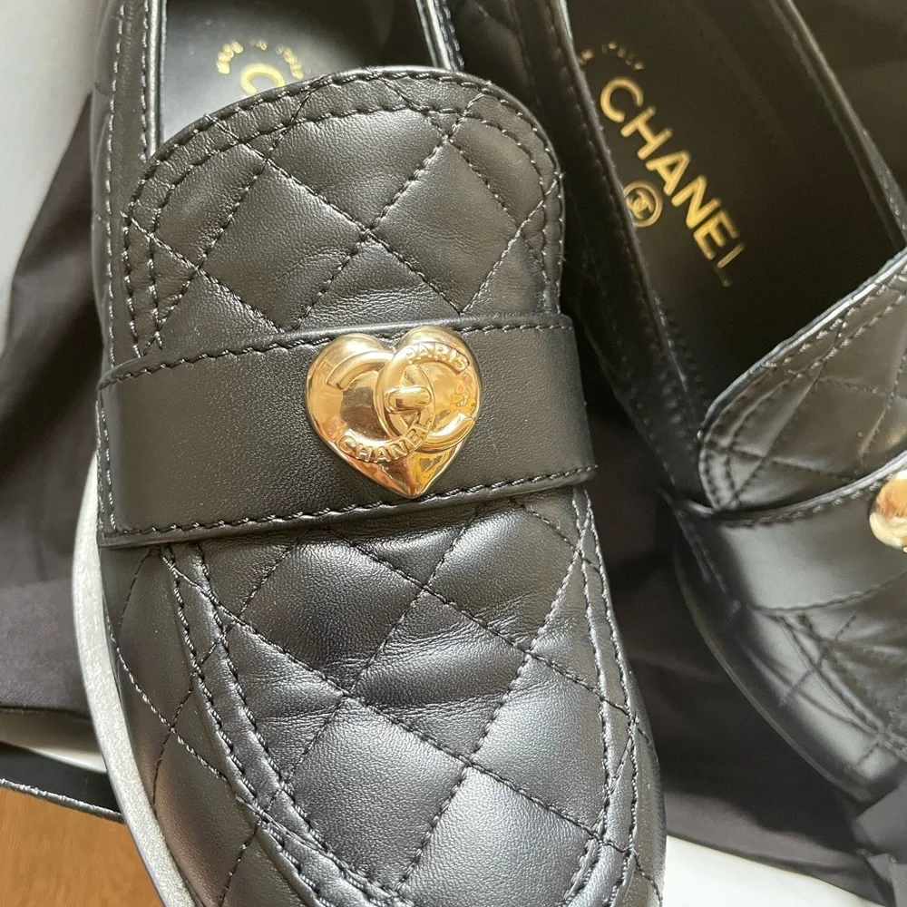 CHANEL Black Quilted Loafers with Gold Accent - Picture 2 of 6